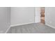 Neutral bedroom featuring plush gray carpeting, light gray walls, and bright white trim at 4280 Zachary Ln, Westfield, IN 46062