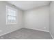 A carpeted bedroom with neutral colored walls features a window at 4280 Zachary Ln, Westfield, IN 46062