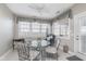 A cozy dining area with tile flooring features a round table and lots of natural light at 4280 Zachary Ln, Westfield, IN 46062