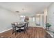 A dining room features wood flooring and a wooden dining table with seating for six at 4280 Zachary Ln, Westfield, IN 46062