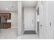 Inviting foyer with tiled flooring, leading to the kitchen and a carpeted bedroom at 4280 Zachary Ln, Westfield, IN 46062