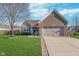 Charming brick and siding home with a well-manicured lawn and attached two-car garage at 4280 Zachary Ln, Westfield, IN 46062