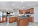 Well-lit kitchen with stainless appliances, granite counters, and seamless flow to the dining area at 4280 Zachary Ln, Westfield, IN 46062