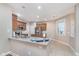 Updated kitchen with an island, granite countertops, stainless appliances, and tiled floors at 4280 Zachary Ln, Westfield, IN 46062