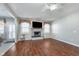 A living room with wood floors features a decorative fireplace and a ceiling fan at 4280 Zachary Ln, Westfield, IN 46062