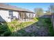 Spacious backyard featuring a large dog kennel, wood fence, and grass, backing to neighboring property at 498 Lake Shore Ct, Franklin, IN 46131