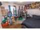 This bedroom is currently used for collections storage, and has a black bedspread with a dark blue patterned design at 498 Lake Shore Ct, Franklin, IN 46131