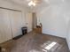 A clean and bright bedroom with neutral carpet, a ceiling fan, and a view into an adjacent room at 498 Lake Shore Ct, Franklin, IN 46131