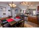 Eat-in kitchen featuring granite countertops, stainless steel appliances, and open view to the living room at 498 Lake Shore Ct, Franklin, IN 46131