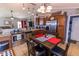 Modern kitchen with stainless steel appliances, granite counters, a breakfast nook, and view to living room at 498 Lake Shore Ct, Franklin, IN 46131