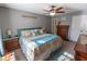 Cozy main bedroom featuring a ceiling fan, neutral paint, and well-placed bedside tables and dressers at 498 Lake Shore Ct, Franklin, IN 46131