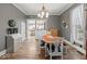 Open-concept dining room featuring a chandelier and hardwood flooring at 501 S John St, Arcadia, IN 46030