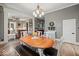 Open-concept dining room featuring a chandelier and hardwood flooring at 501 S John St, Arcadia, IN 46030