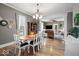 Open-concept dining room featuring a chandelier and hardwood flooring at 501 S John St, Arcadia, IN 46030