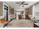 Bright living room with hardwood floors, a ceiling fan, and two comfortable recliners at 501 S John St, Arcadia, IN 46030