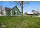 This home features a well-maintained lawn and mature tree providing plenty of shade at 501 S John St, Arcadia, IN 46030