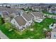 Aerial shot of townhomes with well-kept lawns, patios, and landscaped backyards in a Gathering-friendly neighborhood at 503 Fayette Dr, Westfield, IN 46074