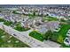 Overhead image capturing townhomes near green spaces, walking paths, and a small pond, enhancing community living at 503 Fayette Dr, Westfield, IN 46074