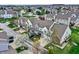 Overhead perspective of townhomes and flowering trees showcasing the architecture and community layout at 503 Fayette Dr, Westfield, IN 46074