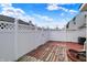 Backyard featuring a wooden patio surrounded by a white privacy fence at 503 Fayette Dr, Westfield, IN 46074