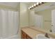 Well-lit bathroom with a shower-tub, vanity with sink, and neutral decor at 503 Fayette Dr, Westfield, IN 46074