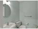 Powder room featuring blue paint, a round mirror, and a pedestal sink at 503 Fayette Dr, Westfield, IN 46074