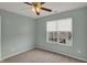 Bedroom featuring neutral carpet and paint, a ceiling fan, and a window with neighbor views at 503 Fayette Dr, Westfield, IN 46074