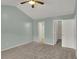 Comfortable bedroom with ensuite bath and walk-in closet featuring carpeted floor and ceiling fan at 503 Fayette Dr, Westfield, IN 46074