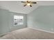 Spacious bedroom featuring neutral carpet, a ceiling fan, and a large window for natural light at 503 Fayette Dr, Westfield, IN 46074