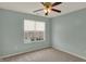 Carpeted bedroom featuring neutral paint, a window and ceiling fan at 503 Fayette Dr, Westfield, IN 46074