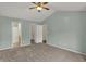 Cozy bedroom with attached bath and closet; carpeted floor; neutral paint; ceiling fan at 503 Fayette Dr, Westfield, IN 46074
