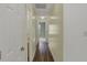 Hallway view featuring wood floors and white doors at 503 Fayette Dr, Westfield, IN 46074