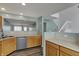 View of the kitchen featuring wood cabinets, stainless steel appliances, and open sight lines at 503 Fayette Dr, Westfield, IN 46074