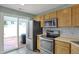 Bright kitchen with stainless steel appliances, and slider to back patio at 503 Fayette Dr, Westfield, IN 46074