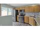 Updated kitchen with stainless steel appliances, modern backsplash, and ample cabinetry at 503 Fayette Dr, Westfield, IN 46074