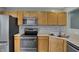 Kitchen featuring wood cabinets, stainless steel appliances, and double sink at 503 Fayette Dr, Westfield, IN 46074