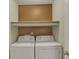 Convenient laundry room with a washer, dryer, and storage shelf at 503 Fayette Dr, Westfield, IN 46074