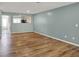 Open living room with wood floors and light blue walls at 503 Fayette Dr, Westfield, IN 46074