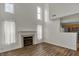 The living room has a fireplace with white curtains and wood floors at 503 Fayette Dr, Westfield, IN 46074