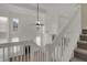Second floor view of the living room featuring white walls and an indoor ceiling fan at 503 Fayette Dr, Westfield, IN 46074