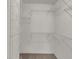 Walk-in closet showcasing ample white metal shelving and carpeted floor at 503 Fayette Dr, Westfield, IN 46074