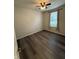 Bedroom with hardwood floors, ceiling fan, and window at 5069 Lilium Dr, Plainfield, IN 46168