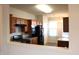 Kitchen with wood cabinets, modern appliances, and an open design at 5069 Lilium Dr, Plainfield, IN 46168