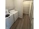 Bright laundry room with a washer and dryer, along with shelving at 5069 Lilium Dr, Plainfield, IN 46168