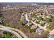Beautiful aerial view of a neighborhood showcasing lush landscapes, mature trees, and a serene residential community at 5343 Ripplingbrook Way, Carmel, IN 46033