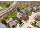 Aerial view of residential homes and neighborhood with manicured lawns, mature trees, and landscaping for a tranquil setting at 5343 Ripplingbrook Way, Carmel, IN 46033