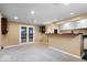 View of finished basement with dart board, bar, and double doors to theater room at 5343 Ripplingbrook Way, Carmel, IN 46033