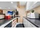 Finished basement wet bar with countertop, microwave and sink at 5343 Ripplingbrook Way, Carmel, IN 46033