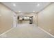 Spacious finished basement with carpet flooring and recessed lighting, perfect for entertaining at 5343 Ripplingbrook Way, Carmel, IN 46033