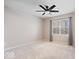Bedroom featuring plush carpeting, neutral walls, large window and modern ceiling fan at 5343 Ripplingbrook Way, Carmel, IN 46033